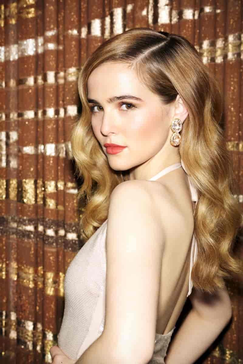 Zoey Deutch wears her hair in bombshell waves with a La Perla swimsuit