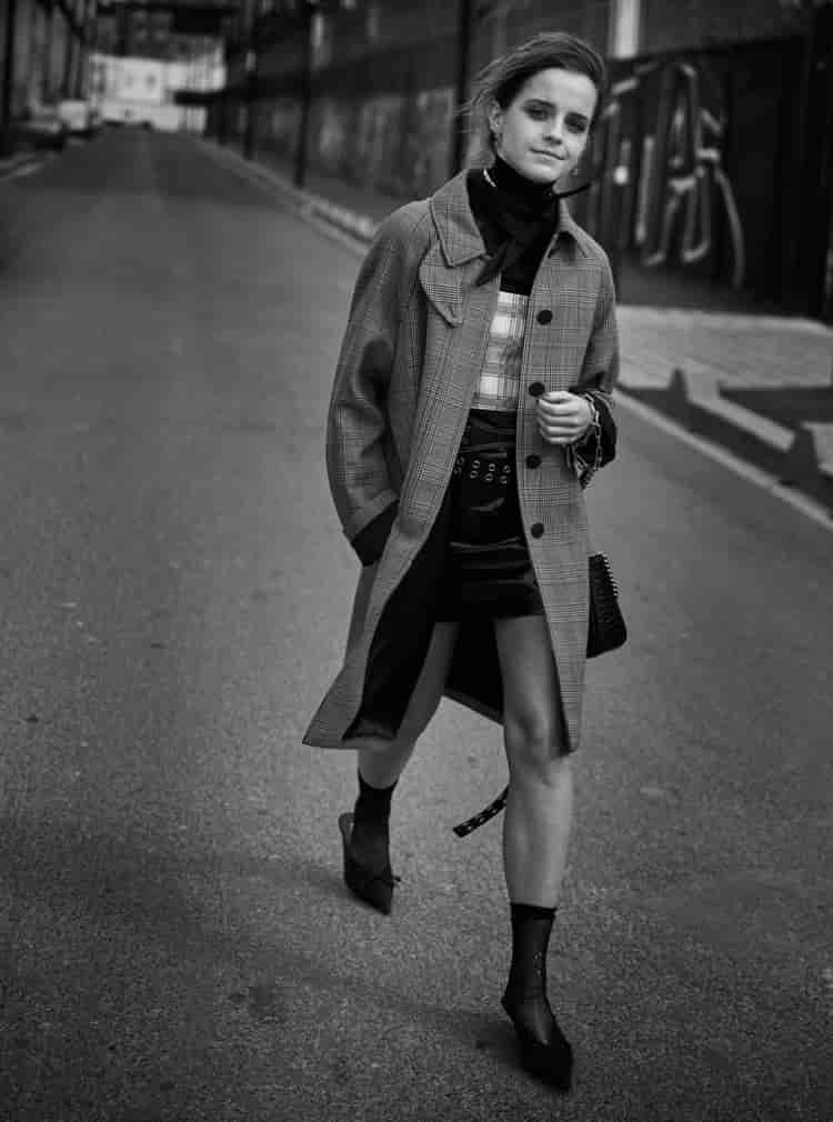 Taking a stroll, Emma Watson poses in Louis Vuitton coat, Prada top and UNIF skirt