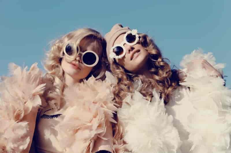 Whimsical, oversized sunglasses offer a carefree spirit.