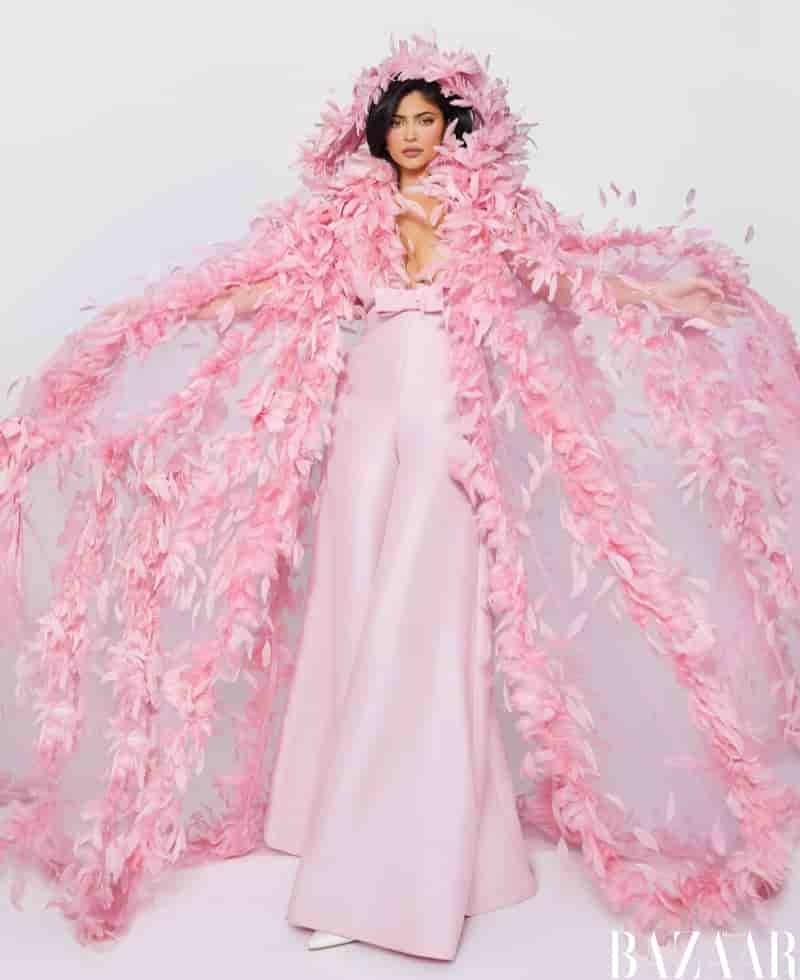Looking pretty in pink, Kylie Jenner wears Valentino Haute Couture cape and jumpsuit