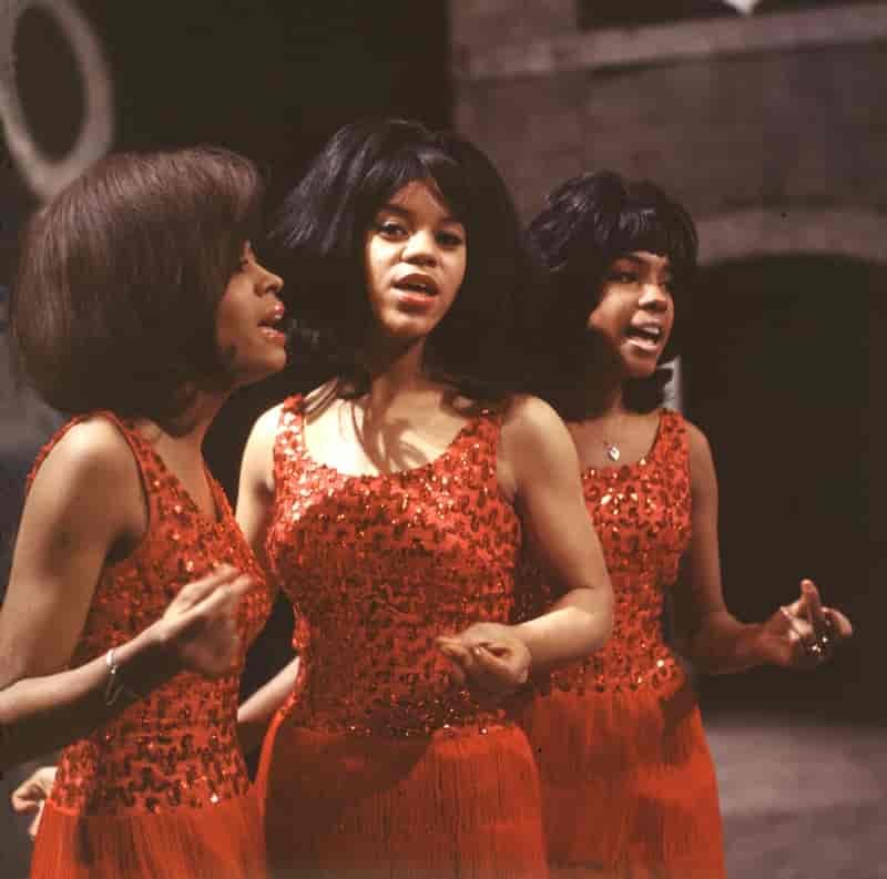 Diana Ross and The Supremes wearing red dresses in the 1960s. The group's glamorous outfits made them stand out. | Photo Credit: Pictorial Press Ltd / Alamy Stock Photo
