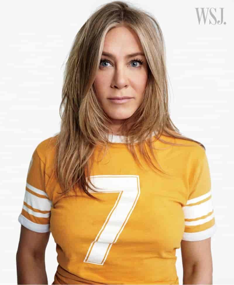 Wearing a yellow t-shirt, Jennifer Aniston shows off casual style.