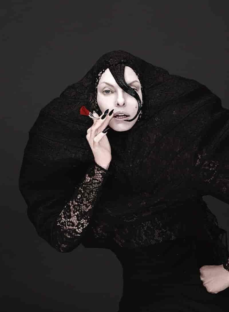 Linda Evangelista strikes a dramatic pose in layered lace from Aziz.