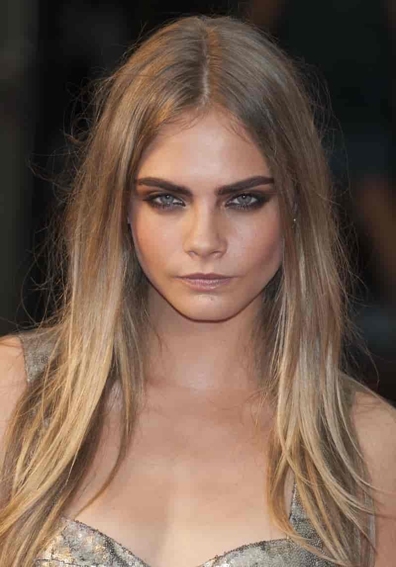 Messy hair and smudged eyeliner complete the rock and roll beauty look.
