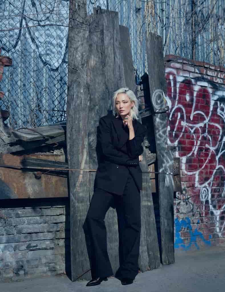 Actress Pom Klementieff wears all-black 7 For All Mankind look.