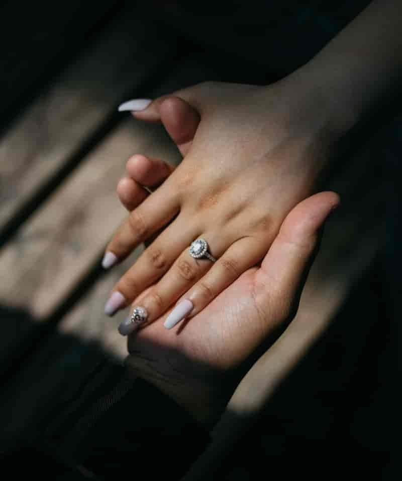 Holding Hands Engagement Ring