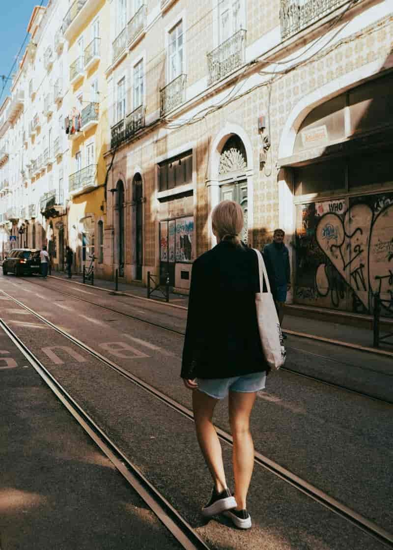 Woman walking street portugal