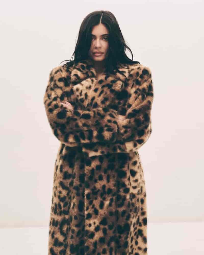 Kylie Jenner poses in faux fur coat from Khy's Holiday Shop.
