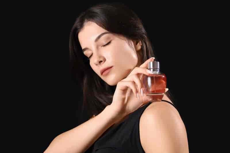 Holding Perfume Bottle