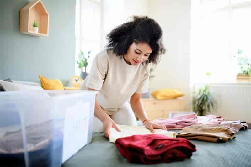 Woman Folding Clothes